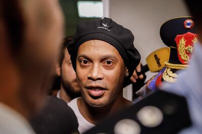epa08275712 Ronaldo de Assis Moreira, a.k.a. Ronaldinho (C), leaves the Palace of Justice after appearing before Judge Mirko Valinotti, in Asuncion, Paraguay, 06 March 2020. The appeal to the "abbreviated procedural exitâ€™ was granted by the Prosecutor's Office to Brazil's former soccer star Ronaldinho Gaucho and his brother Roberto after being cited for entering Paraguay with false passports.  EPA/NATHALIA AGUILAR