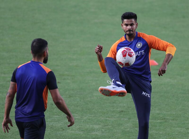 India's Shreyas Iyer passes a football during training. AP