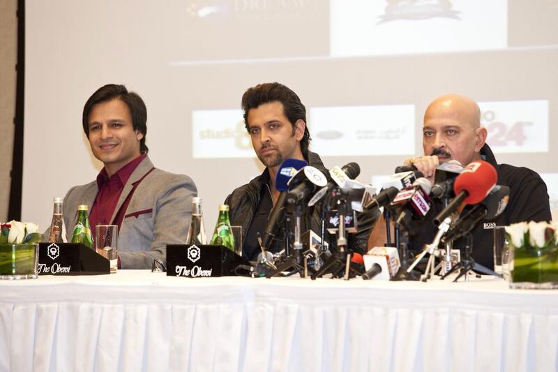 From left, Vivek Oberoi, Hrithik Roshan and Rakesh Roshan at a press conference for Krrish 3 in Dubai. Razan Alzayani / The National