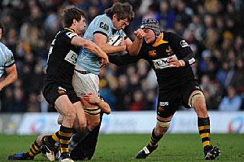 The Wasps defenders halt Leicester's Geoff Parling.