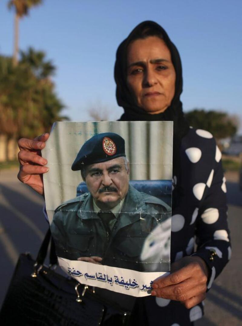 A demonstrator holds a picture of Eastern Libyan military commander Khalifa Haftar during a protest in Benghazi, Libya, February 12, 2017. Esam Omran Al Fetori / Reuters
