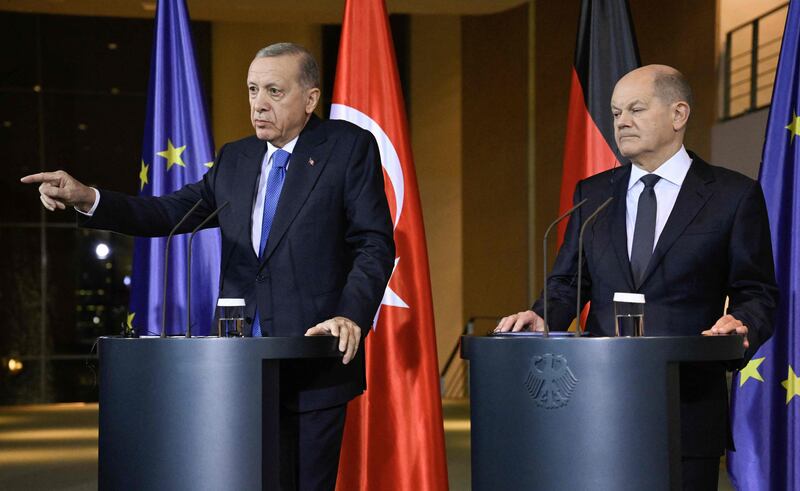 German Chancellor Olaf Scholz, right, and Turkish President Recep Tayyip Erdogan address a joint press conference before talks in Berlin. AFP