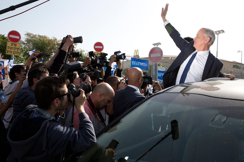 Blue and White party leader Benny Gantz waves to his supporters after casting vote during Israel's general elections in Rosh Haayin, Israel. AP