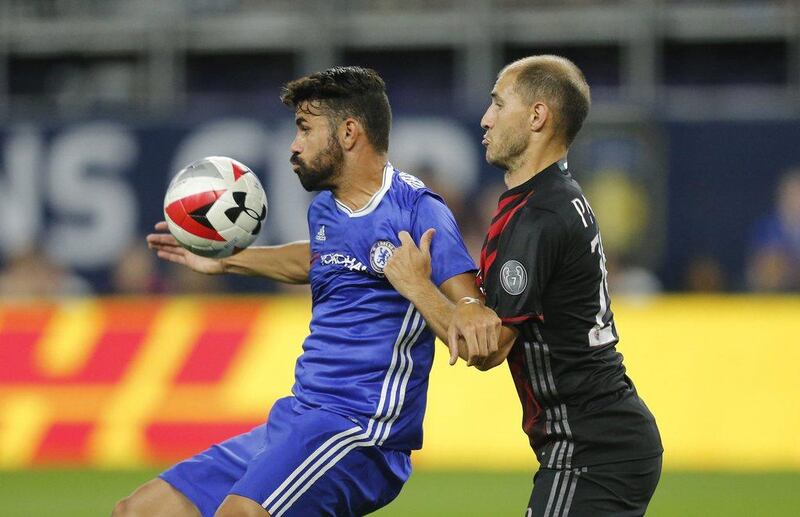 Chelsea striker Diego Costa in action with AC Milan’s Gabriel Paletta. Eric Miller / Reuters