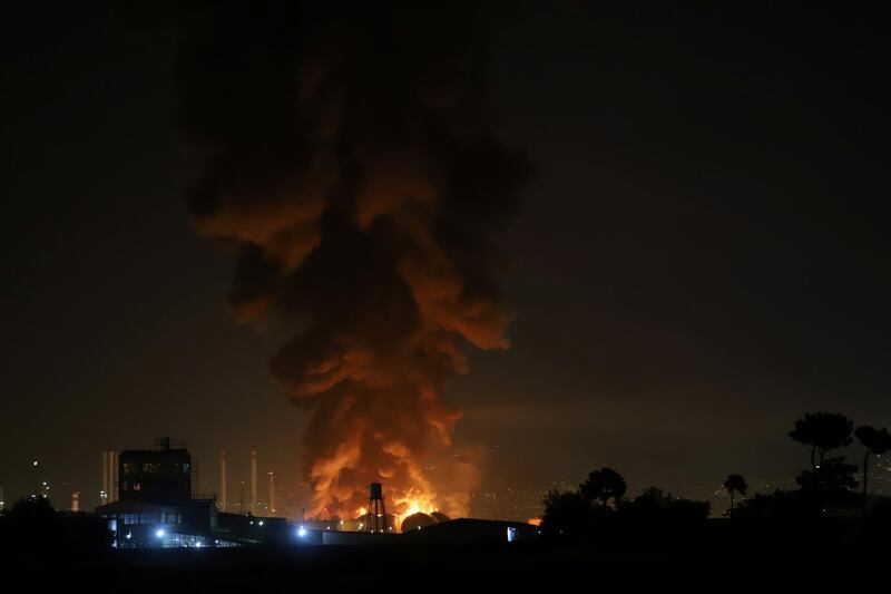 Smoke rises at an oil refinery in Tehran, Iran. Reuters