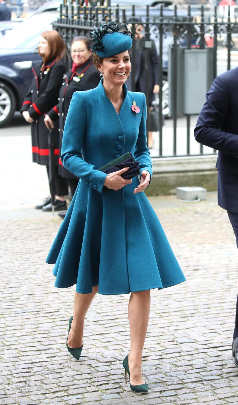 The Duchess of Cambridge wears a teal Catherine Walker coatdress, a Rosie Olivia Millinery hat, Emmy London Rebecca pumps, an Emmy clutch and a Kiki McDonough necklace for the ANZAC Day Service of Commemoration and Thanksgiving at Westminster Abbey on April 25, 2019 in London. Getty Images
