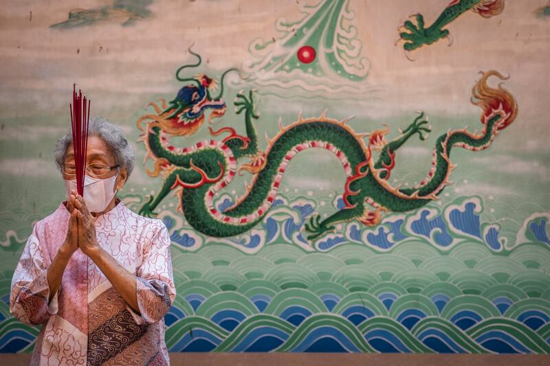 An elderly woman prays in Bali, Indonesia. The first day of the Lunar New Year, on February 1, ushered in the Year of the Tiger. Getty Images