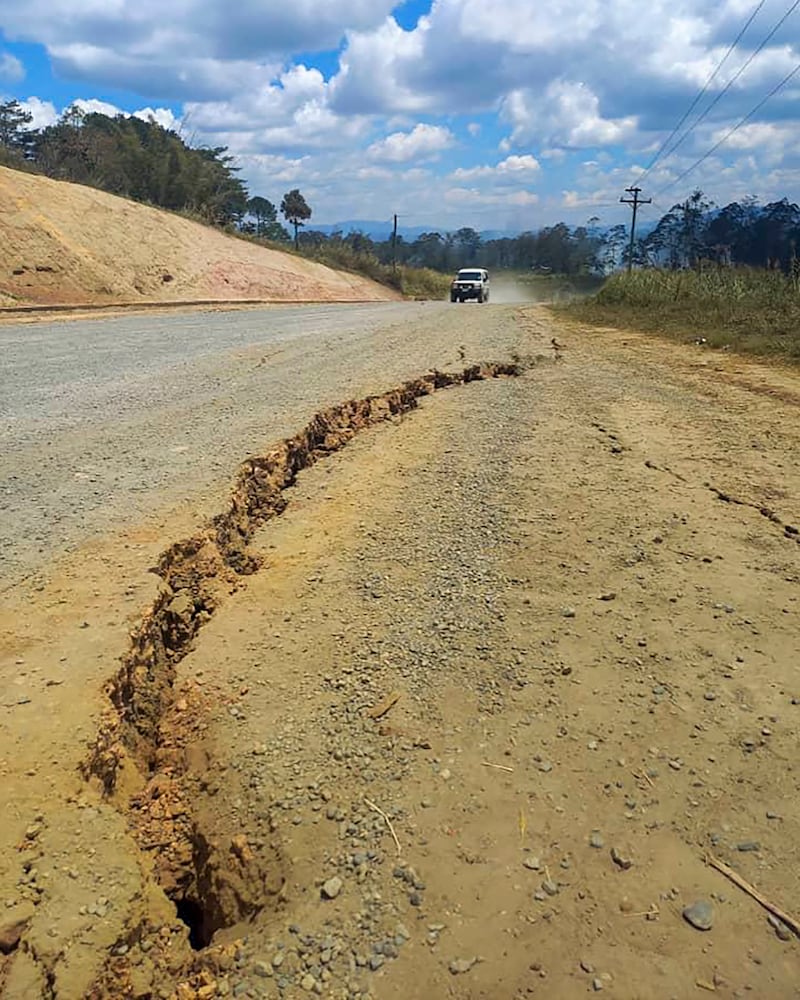 A large crack is seen in a highway near the town of Kainantu, following the powerful quake.