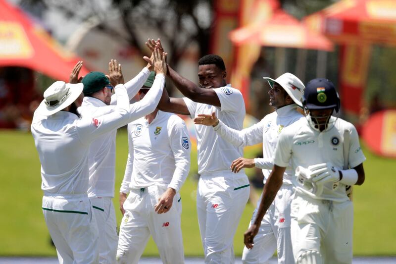 South African bowler Lungi Ngidi (3rd R) celebrates the dismissal of Indian batsman Hardik Pandya (R) during the fifth day of the second Test cricket match between South Africa and India at Supersport cricket ground on January 17, 2018 in Centurion.  / AFP PHOTO / GIANLUIGI GUERCIA