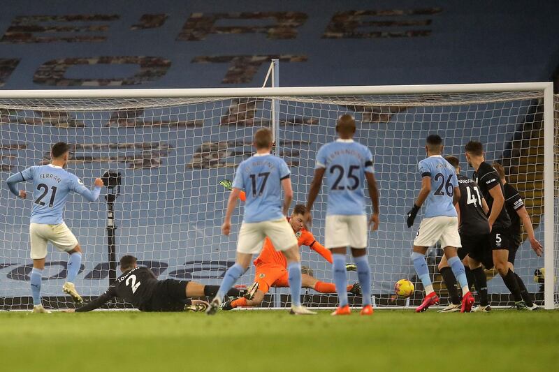 Manchester City's midfielder Ferran Torres scores his team's fourth goal. AFP