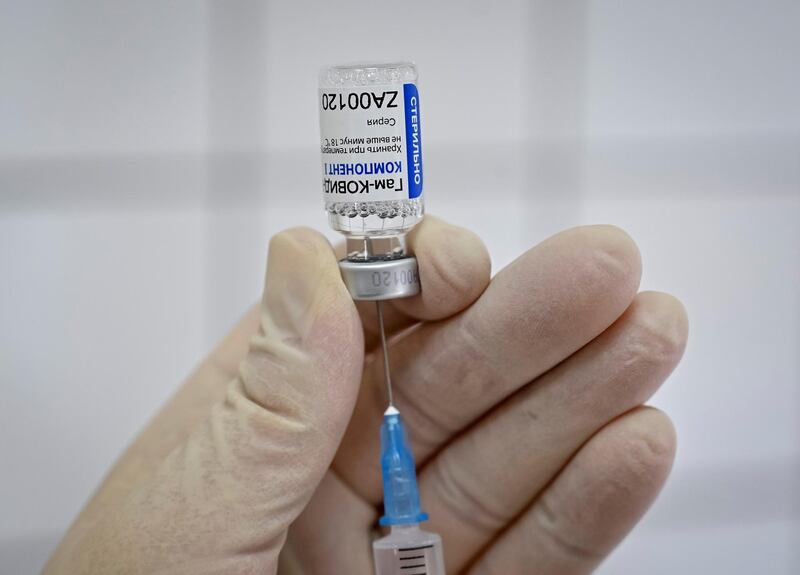 FILE PHOTO: A medical worker fills a syringe with Sputnik V (Gam-COVID-Vac) vaccine as she prepares to vaccinate a Russian Army service member at a clinic in the city of Rostov-On-Don, Russia December 22, 2020.  REUTERS/Sergey Pivovarov/File Photo