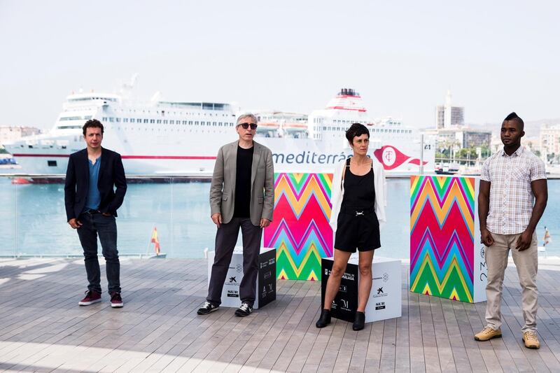 Spanish film director David Trueba (2-L), Spanish actors Vito Sanz (L) and Anna Alarcon (2-R), and Guinean actor Zidane Barry (R) pose during the presentation of the movie 'A este lado del mundo' (lit. this side of the world) at the Official Category of the 23rd edition of Malaga Film Festival, in Malaga, Spain. EPA