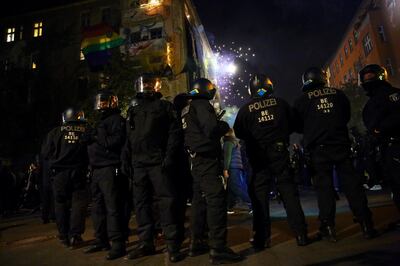 Police officers stand guard as supporters of the left-wing Liebig 14 housing project protest against the eviction of former squat Liebig 14 in Berlin, Germany, October 3, 2020. REUTERS/Christian Mang