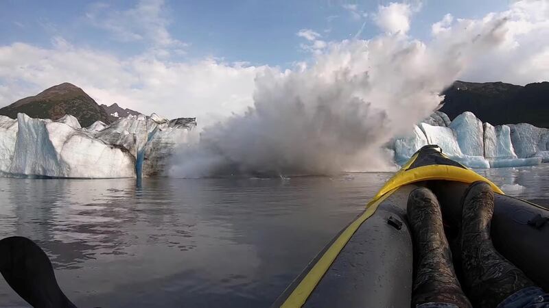 The Spencer Glacier collapses, forming a big wave moments before it crashes into a kayaker, in Alaska. @steeringsouth / via Reuters