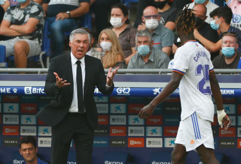 Real Madrid's head coach Carlo Ancelotti gives instructions to Eduardo Camavinga. AP Photo