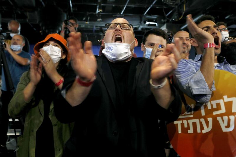 Supporters cheer during a Yesh Atid party event in Tel Aviv. Bloomberg