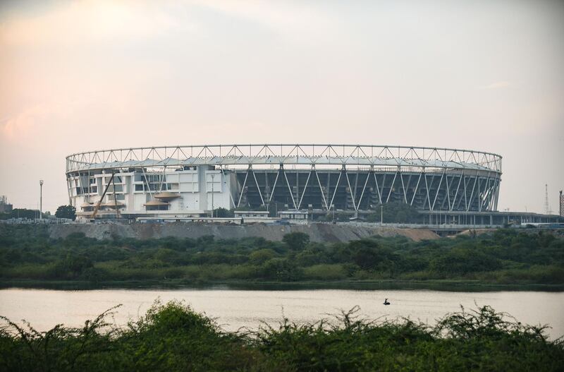 An Indian fisherman on the Sabarmati river which runs next to the world's largest cricket stadium being constructed in Motera. AFP