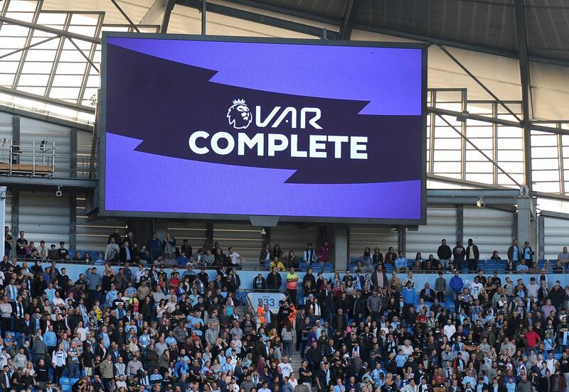 Fans wait while a possible goal by Manchester City's Gabriel Jesus is checked by VAR during the English Premier League soccer match between Manchester City and Tottenham Hotspur at Etihad stadium in Manchester, England.  AP