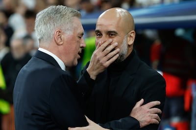 Real Madrid's head coach Carlo Ancelotti, left, greets Manchester City's Pep Guardiola before the match. EPA
