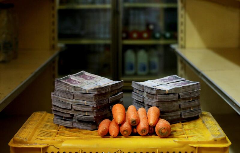 A kilogram of carrots is pictured next to 3,000,000 bolivars