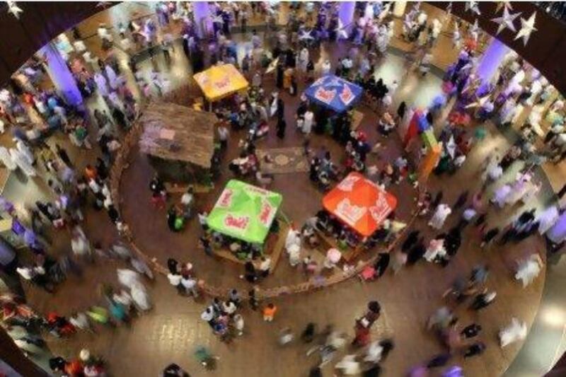 Families spend the early hours yesterday at a shopping mall in Dubai as they celebrate the last day of the Eid al-Fitr holiday. AFP