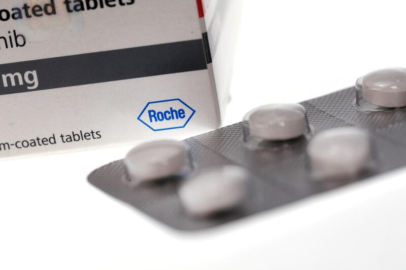 A box of Erlotinib 100mg tablets, also known by its brand name Tarceva, a cancer treatment drug manufactured by Roche Holding AG, sits alongside a blister pack of five tablets in this arranged photograph in London, U.K., on Friday, April 27, 2018. Tarceva, which is relatively unusual among cancer treatments in that it is given by mouth rather than injection, is for the initial treatment of people with EGFR mutation-positive metastatic non-small cell lung cancer. Photographer: Chris Ratcliffe/Bloomberg via Getty Images