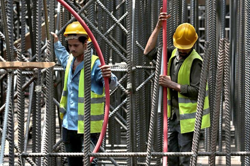 Workers from Saudi Binladin Group do foundation work at the Jeddah construction site of Kingdom Tower, which aims to become the world’s tallest skyscraper when completed. Hasan Jamali / AP Photo