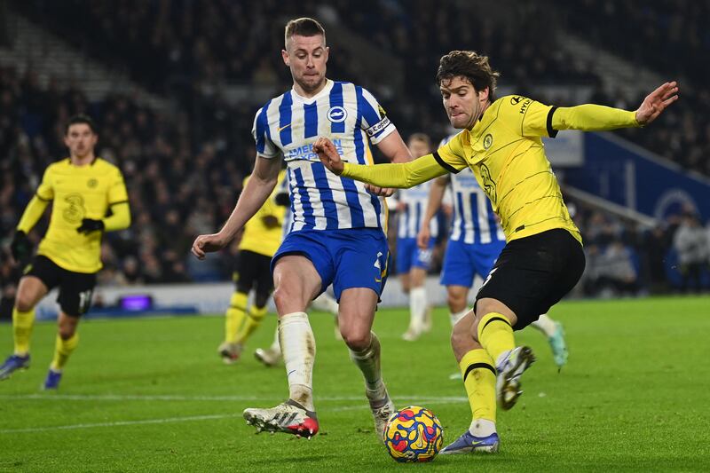 Chelsea's Spanish defender Marcos Alonso vies with Brighton's English defender Adam Webster. AFP