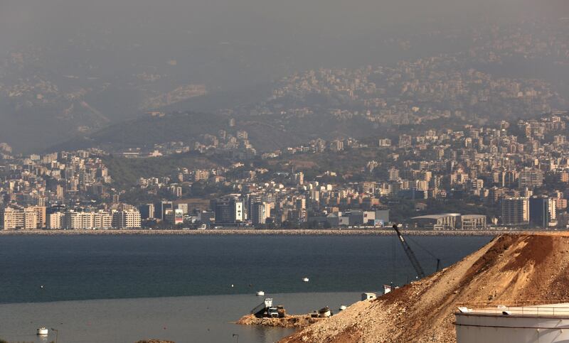 A truck pours earth into the Mediterranean sea to extend the closed Bourj Hammoud land fill on the outskirts of the Lebanese capital Beirut. The Bourj Hammoud solid waste dump occupies a surface area of 16.3 hectares and rises to about 55 m above sea level. Patrick Baz / AFP