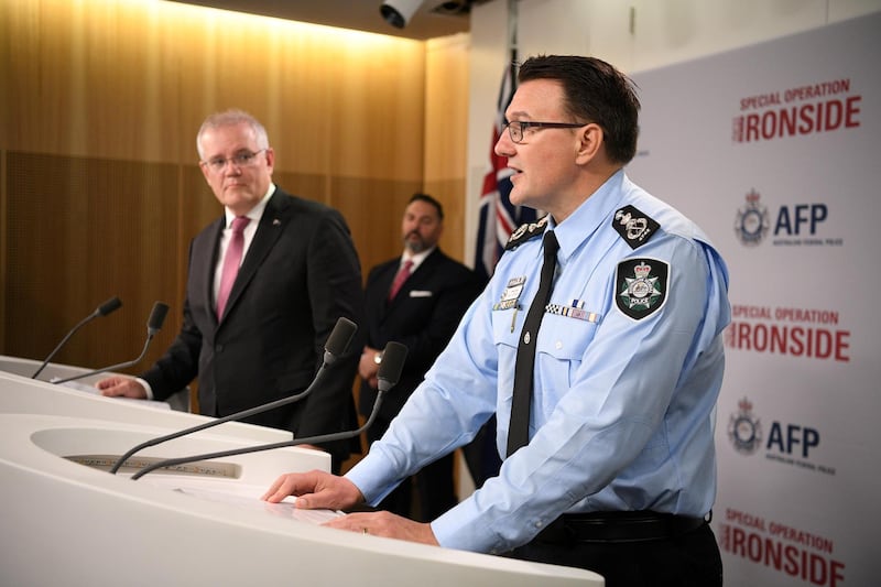 In Sydney, Commissioner Reece Kershaw explains the Australian Federal Police's role in Operation Ironside as Prime Minister Scott Morrison looks on. Reuters
