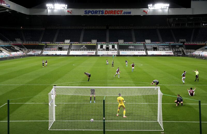 Newcastle United's Ciaran Clark (bottom right) reacts after scoring an own goal. PA