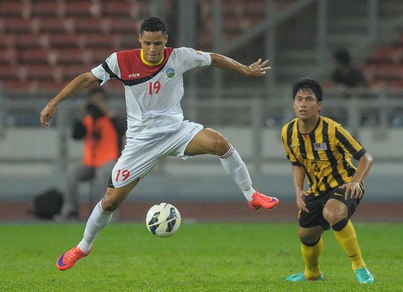 Patrick Fabiano's East Timor, left, drew 1-1 with Mohamad Fadhli's Malaysia in their 2018 World Cup qualifier in Kuala Lumpur on Thursday. Mohammed Rasfan / AFP