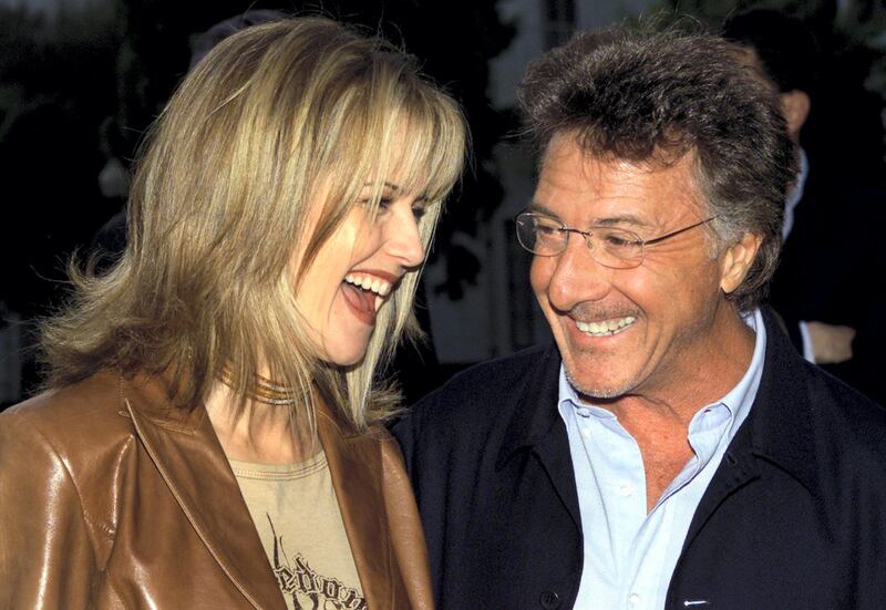 Actors Kelly Preston and Dustin Hoffman share a laugh as they arrive
for the world premiere of the film "Changing Lanes" April 7, 2002 in
Hollywood, California. REUTERS/Robert Galbraith

RG