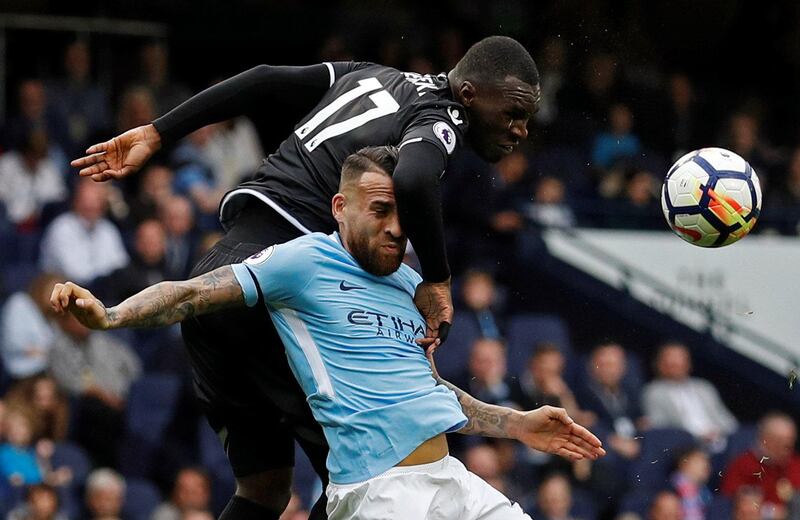 Crystal Palace striker Christian Benteke leaps over Manchester City defender Nicolas Otamendi. Phil Noble / Reuters