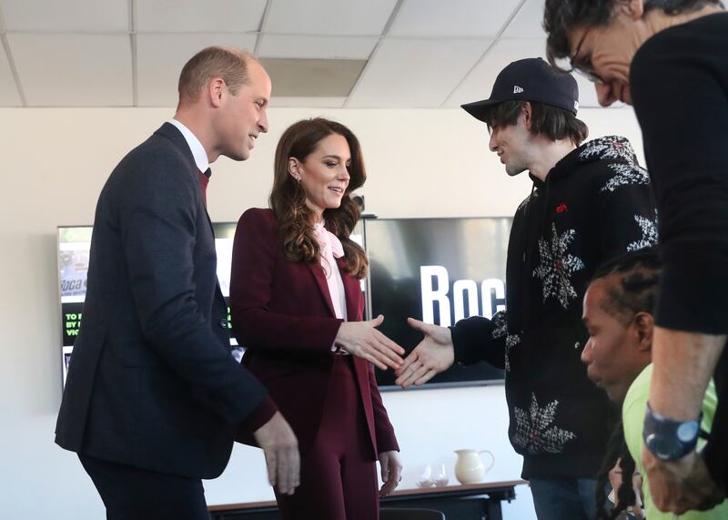 The Prince and Princess of Wales greet Matthew Quinton, who is in the Young Men's Programme at Roca. AP