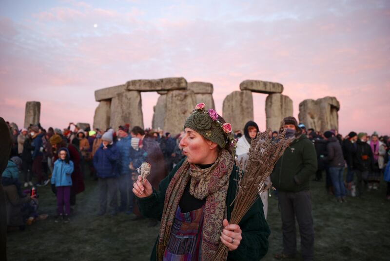 A reveller burns incense at the Stonehenge stone circle to welcome in the winter solstice last year. Reuters / Henry Nicholls