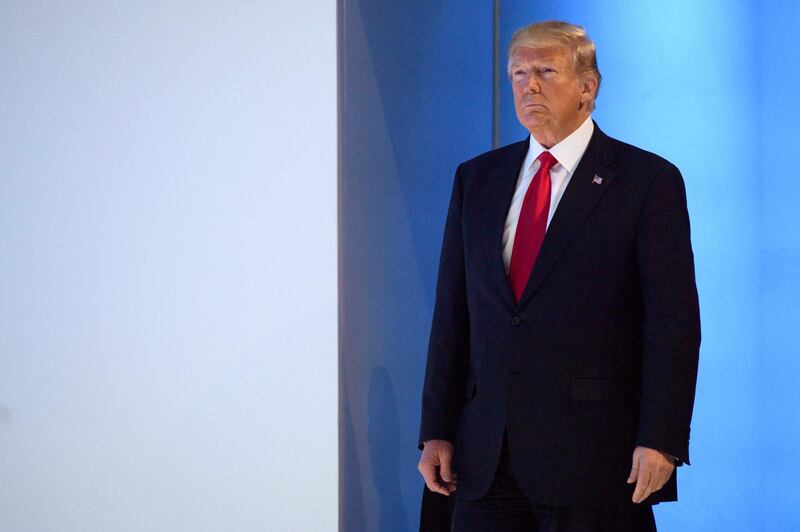 U.S. President Donald Trump, arrives to a plenary session in the Congress Hall on the last day of the annual meeting of the World Economic Forum, WEF, in Davos, Switzerland, Friday, Jan. 26, 2018. (Laurent Gillieron/Keystone via AP)