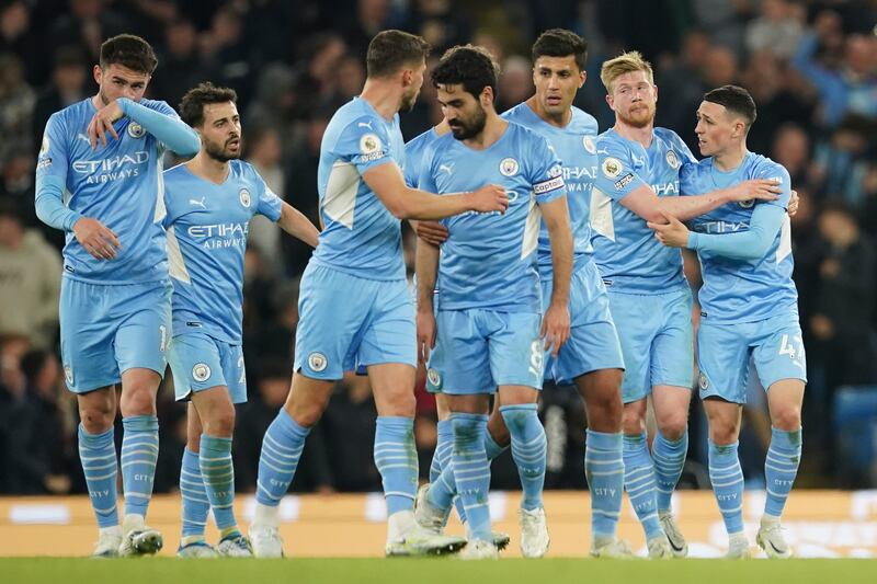 Phil Foden, right, celebrates with his teammates. AP