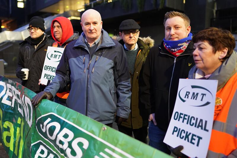 Mick Lynch, general secretary of the RMT, joins union members on the picket line outside London's Euston station. Strikes have been taking place since last summer. PA