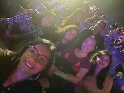 Zoya Thomas, far right, with her newfound friends at the John Legend concert in Abu Dhabi. Zoya Thomas / The National