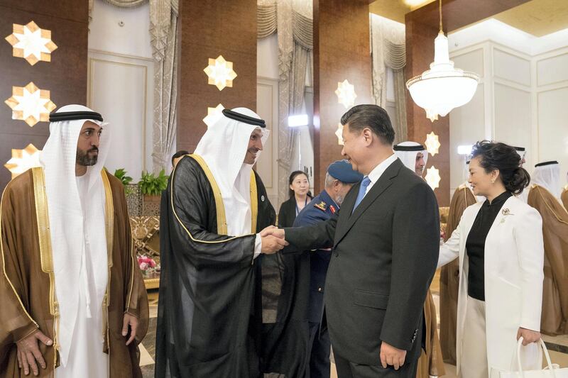 ABU DHABI, UNITED ARAB EMIRATES - July 19, 2018: HE Khaldoon Khalifa Al Mubarak, CEO and Managing Director Mubadala, Chairman of the Abu Dhabi Executive Affairs Authority and Abu Dhabi Executive Council Member (2nd L) greets HE Xi Jinping, President of China (3rd L), during a reception held at the Presidential Airport. Seen with HE Mohamed Mubarak Al Mazrouei, Undersecretary of the Crown Prince Court of Abu Dhabi (L), and Peng Liyuan, First Lady of China (R).

( Mohamed Al Hammadi / Crown Prince Court - Abu Dhabi )
---