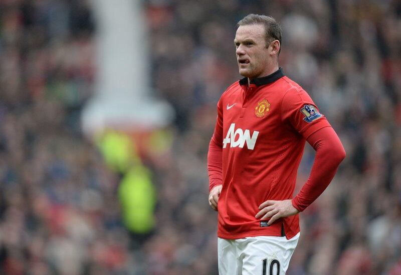 Manchester United striker Wayne Rooney reacts during his side's loss to Liverpool on Sunday. Peter Powell / EPA / March 16, 2014  