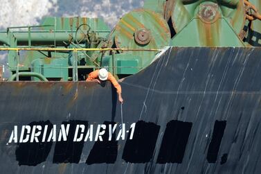 A crew member checks the new name of Iranian oil tanker Grace 1, which the United States sanctioned on Friday for being linked to terrrist activites. AFP