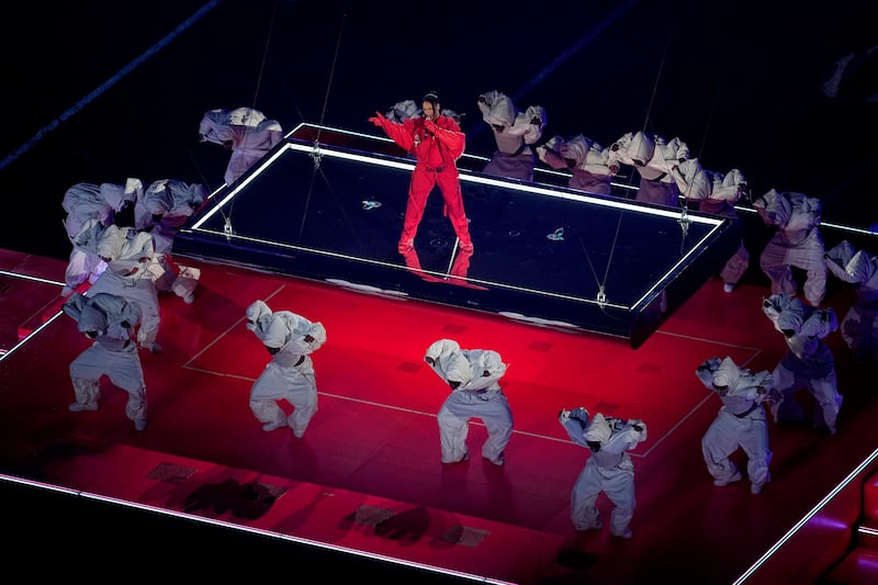 The singer was backed up by dancers clad in white jumpsuits. AP Photo