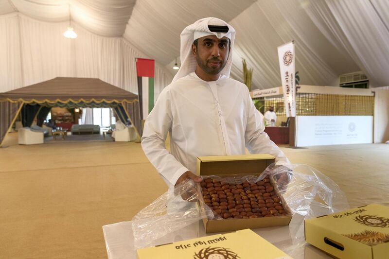 LIWA, UNITED ARAB EMIRATES. 05 October 2017. Liwa Date Auction. Opening day of the first annual Liwa Date Auction. Mohamed Saif Al Mazrouei, a date farmer, shows off his dates that was auctioned off. (Photo: Antonie Robertson/The National) Journalist: Anna Zacharias. Section: National.