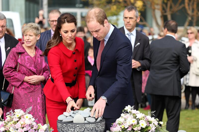 CHRISTCHURCH, NEW ZEALAND - APRIL 14:  Prince William, Duke of Cambridge and Catherine, Duchess of Cambridge lay a stone during a visit the CTV memorial site on April 14, 2014 in Christchurch, New Zealand. The Duke and Duchess of Cambridge are on a three-week tour of Australia and New Zealand, the first official trip overseas with their son, Prince George of Cambridge.  (Photo by Martin Hunter/Getty Images)