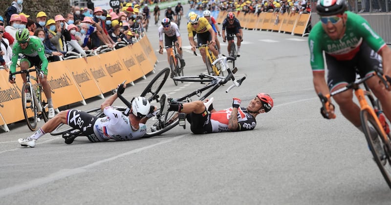 Australian rider Caleb Ewan of Lotto Soudal and Slovakian rider Peter Sagan of Bora-Hansgrohe crash shortly before the finish line of the third stage of the Tour de France on Monday, June 28, 2021. EPA