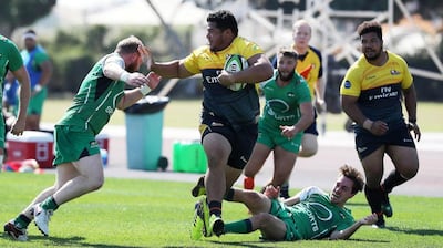 Dubai Hurricanes, in black and yellow, take on Dubai Sports City Eagles in the West Asia Trophy. Pawan Singh / The National