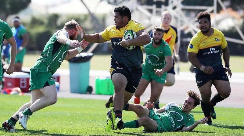 Dubai Hurricanes, in black and yellow, take on Dubai Sports City Eagles in the West Asia Trophy. Pawan Singh / The National