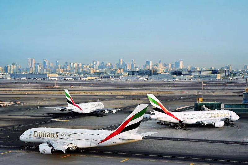 Emirates aircraft sit on the tarmac of Dubai International Airport. Courtesy Emirates
